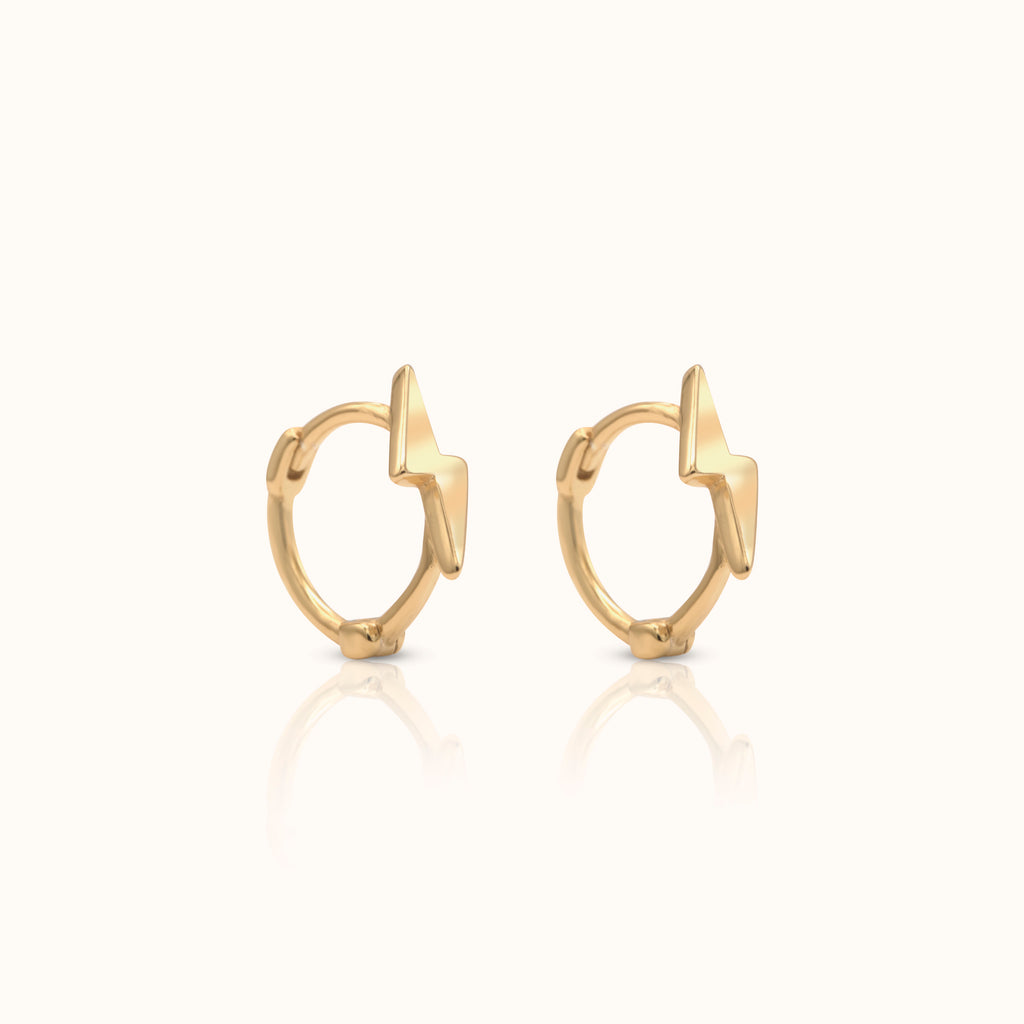 Thick gold hoop earrings with pearl charm